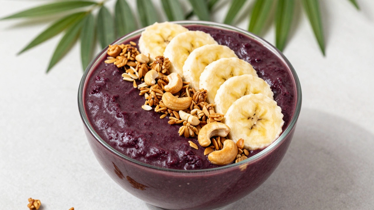 Purple acai bowl topped with bananas and granola on bamboo mat